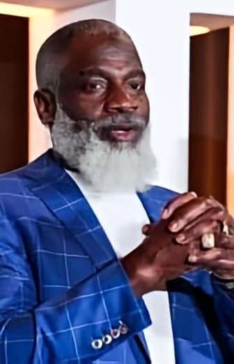 Myron Golden wearing a blue suit